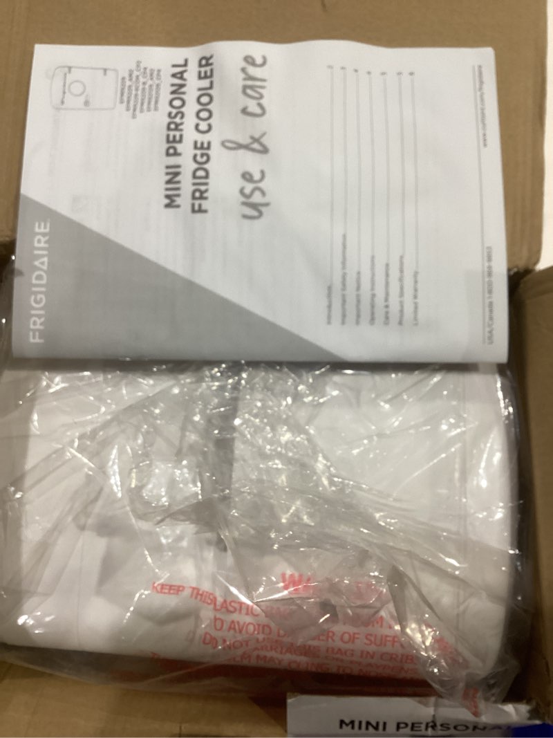 Condition photo showing As Is for Frigidaire EFMIS171 Retro Mini Portable Personal Fridge - Ideal for Home, Office or Dorm - Includes Carrying Handle, AC/DC Wall/Car Charger (White)