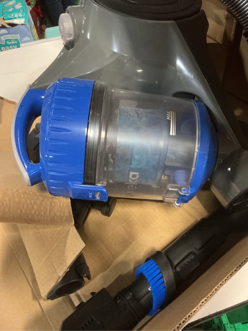 Condition photo showing As Is for bagless canister vacuum cleaner with cord rewind, blue