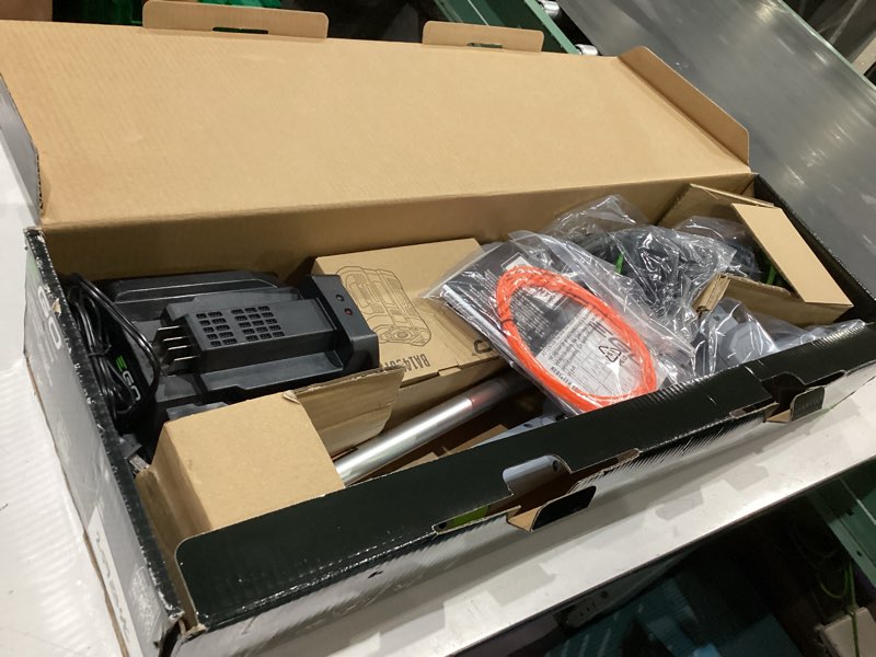 Condition photo showing As Is for ego powerload 56-volt 15-in telescopic shaft battery string trimmer 2.5 ah (battery and charger included)