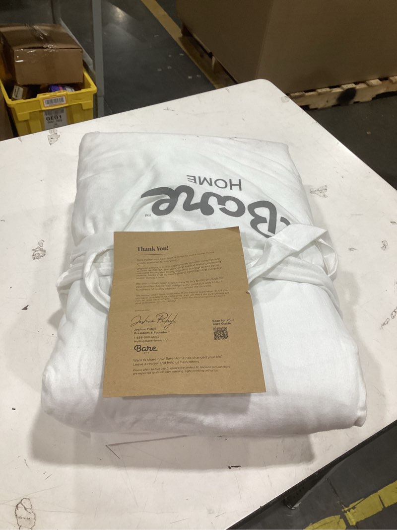 This is a Bare Home white bedding set, likely a sheet set or duvet cover, packaged for shipment.