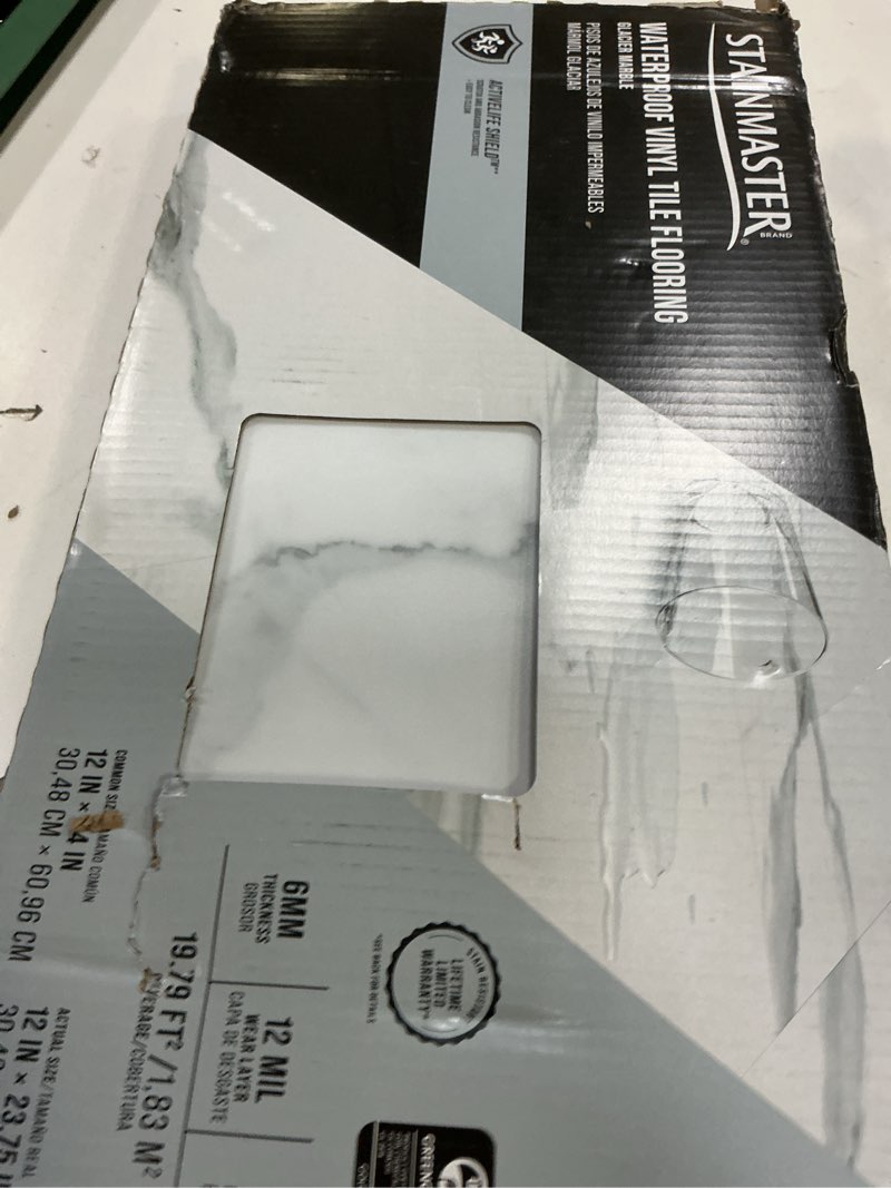 Condition photo showing Good Condition for stainmaster glacier calacatta marble white marble look 12-mil x 12-in w x 24-in l waterproof interlocking luxury vinyl tile flooring (19.79-sq ft/ carton)