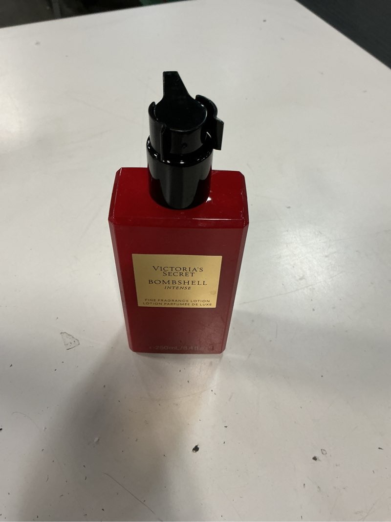 Condition photo showing Good Condition for victoria's secret bombshell intense fragrance body lotion, notes of cherry, red peony & sultry vanilla (8.4 oz)