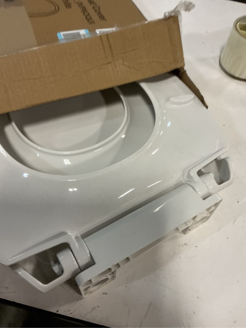 Condition photo showing As Is for toilet seat, elongated toilet seat with toddler seat built in, potty training toilet seat elongated fits both adult and child, with slow close and magnets- elongated