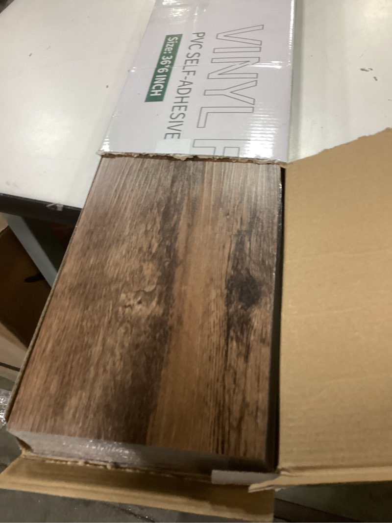 Condition photo showing Good Condition for Peel and Stick Vinyl Flooring 36 Pack 54 Sq.Ft, Waterproof Vinyl Flooring Peel and Stick for Office, Living Room, Bathroom, Kitchen - Unique Design, Easy to Install Floor, Brown 36 x 6 x 0.1 inches Brown 36