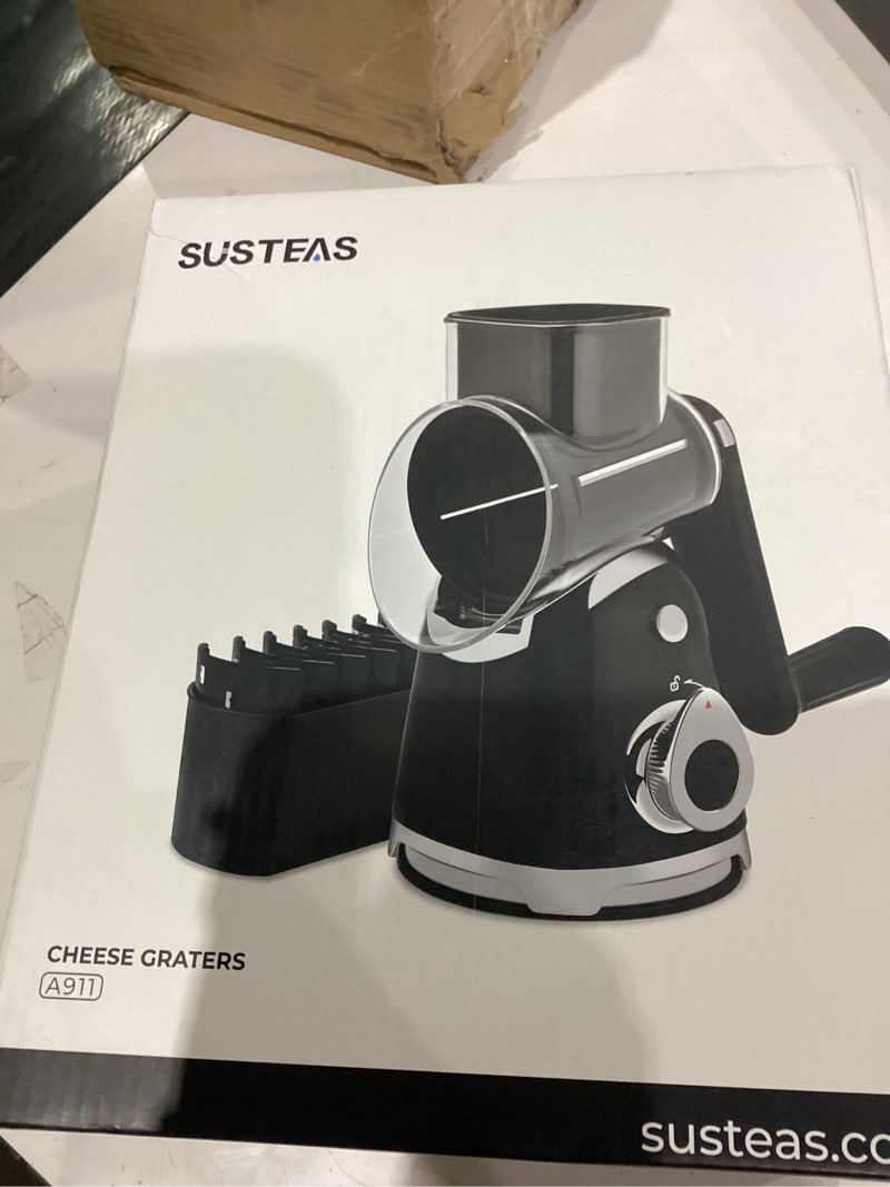 Condition photo showing As Is for SUSTEAS Rotary Cheese Grater with Handle,Vegetable Slicer with 6 Interchangeable Blades, Reinforced Suction,Easy to Clean,Kitchen Shredder for Crushed Ice,Fruits and Nuts with Blade Storage Case,Black