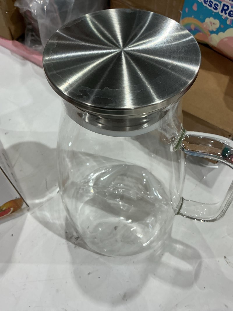 Condition photo showing Good Condition for glass pitcher with lid, 2 liter 68oz water pitcher with handle and spout for fridge, borosilicate glass for iced tea, juice, sangria, cold/hot beverage, large jug 68 ounces