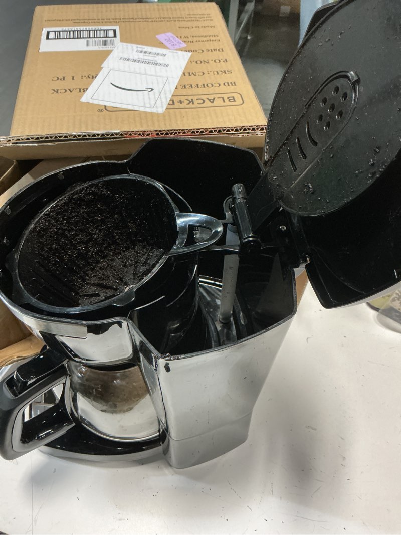 Condition photo showing As Is for black+decker 12-cup digital coffee maker, programmable, washable basket filter, sneak-a-cup, auto brew, water window, keep hot plate, black