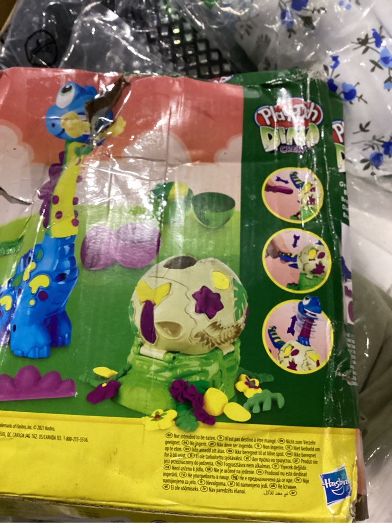 Condition photo showing As Is for play-doh dino crew growin' tall bronto toy dinosaur for kids 3 years and up with 2 eggs, 2.5 ounces each, non-toxic standard packaging
