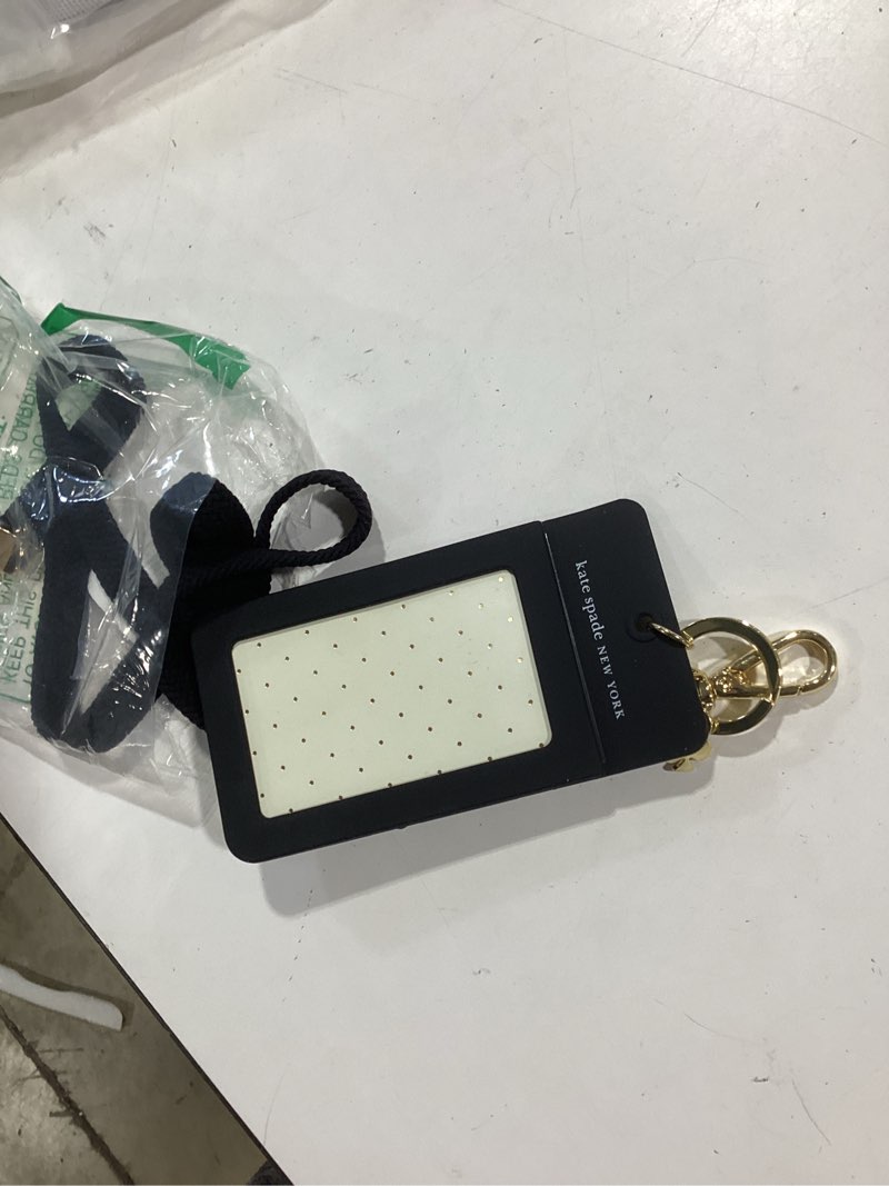 Condition photo showing Good Condition for kate spade new york designer id holder, black dot silicone id clip with gold accents, black lanyard compatible, 6x2.75 in
