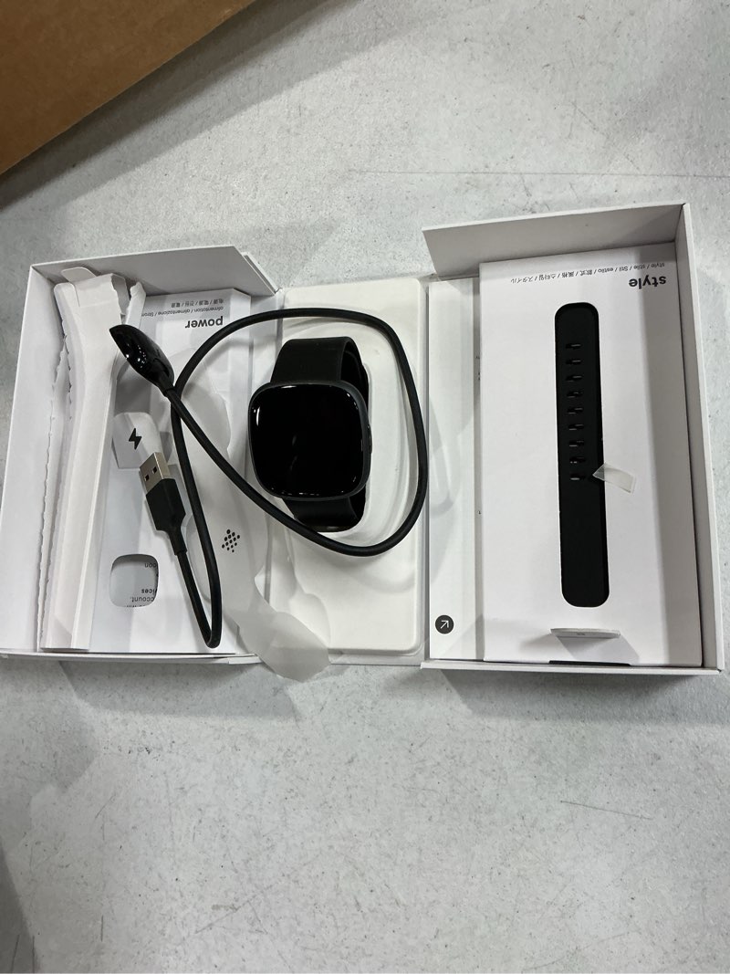 Condition photo showing As Is for fitbit versa 4 fitness smartwatch with daily readiness, gps, 24/7 heart rate, 40+ exercise modes, sleep tracking and more, black/graphite, one size (s & l bands included)
