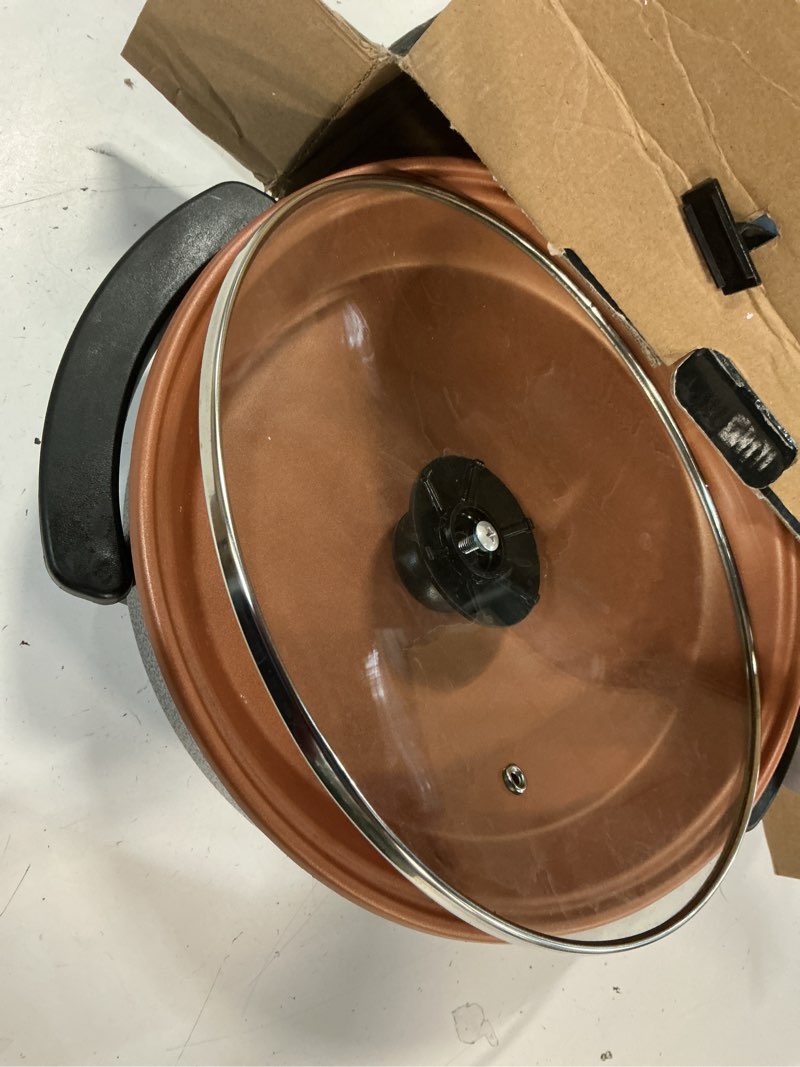 Condition photo showing As Is for ovente electric skillet and frying pan, 12 inch round cooker with nonstick coating, 1400w power, adjustable temperature control, tempered glass lid with vent and cool touch handles, copper sk11112co