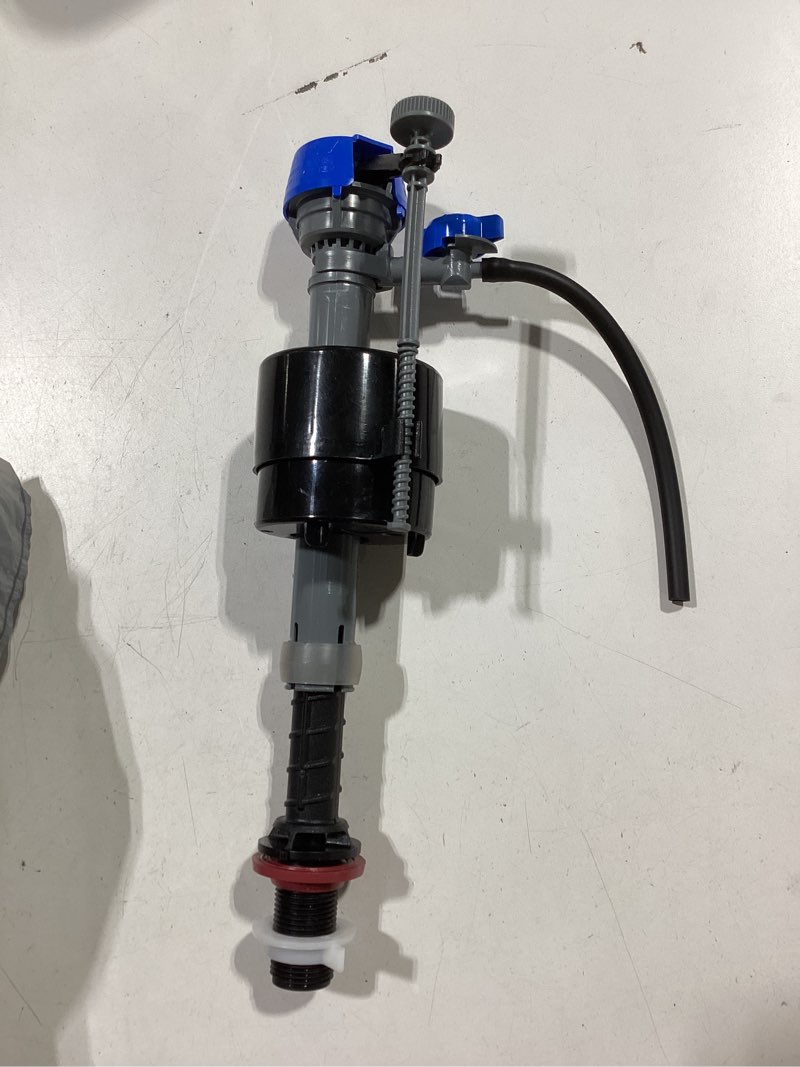 Condition photo showing As Is for fluidmaster universal toilet fill valve and 2-in flapper kit