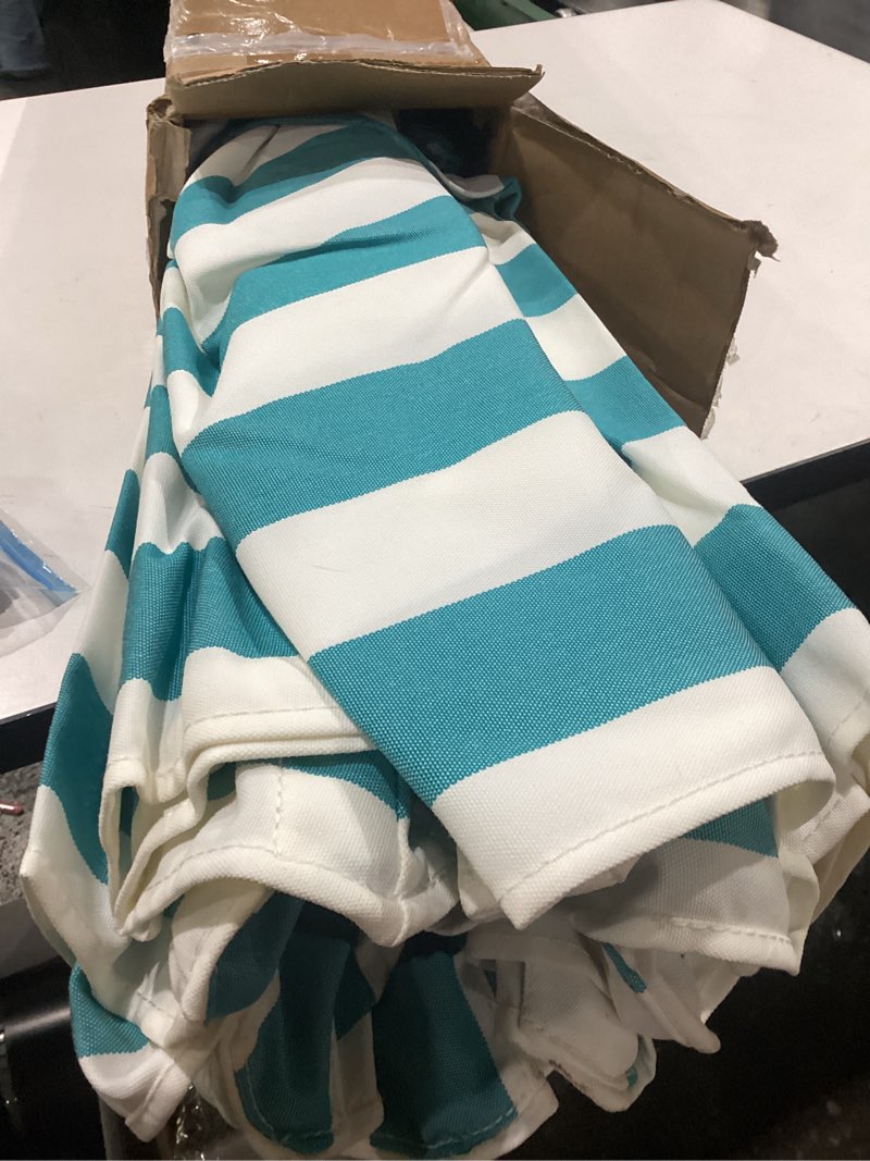 Condition photo showing Good Condition for abccanopy 5-year 10-year no fading 9ft 3 tiers patio umbrella, outdoor table umbrella with 8 sturdy ribs for deck, backyard, garden, yard 5 year non fading 9ft turquoise stripe