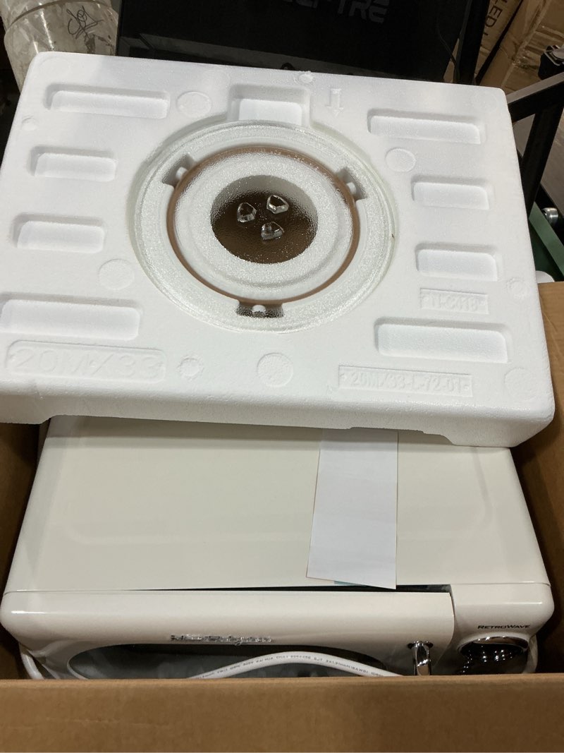 Condition photo showing As Is for nostalgia retro compact countertop microwave oven - 0.7 cu. ft. - 700-watts with led digital display - child lock - easy clean interior - white retro classic 0.7 cu. ft. white