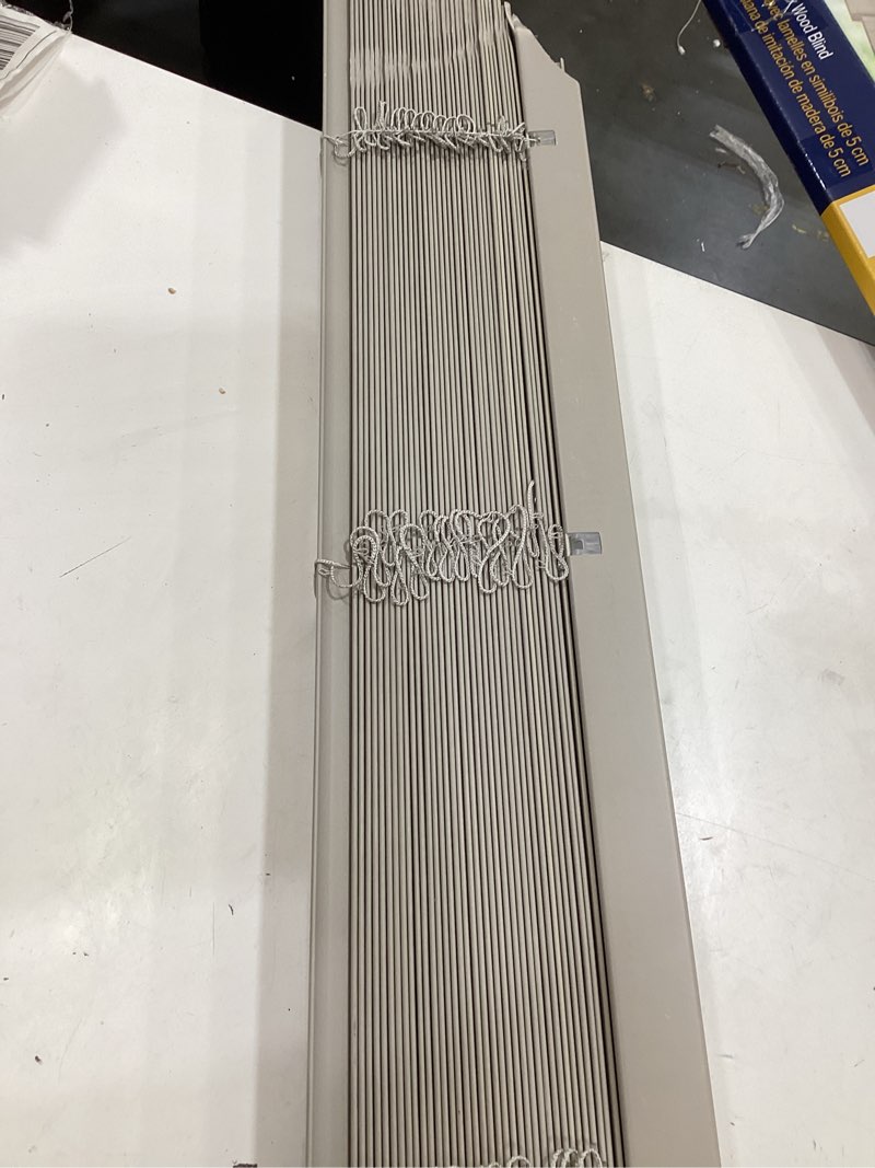 Condition photo showing As Is for levolor trim+go 2-in slat width 72-in x 64-in cordless greige faux wood room darkening horizontal blinds