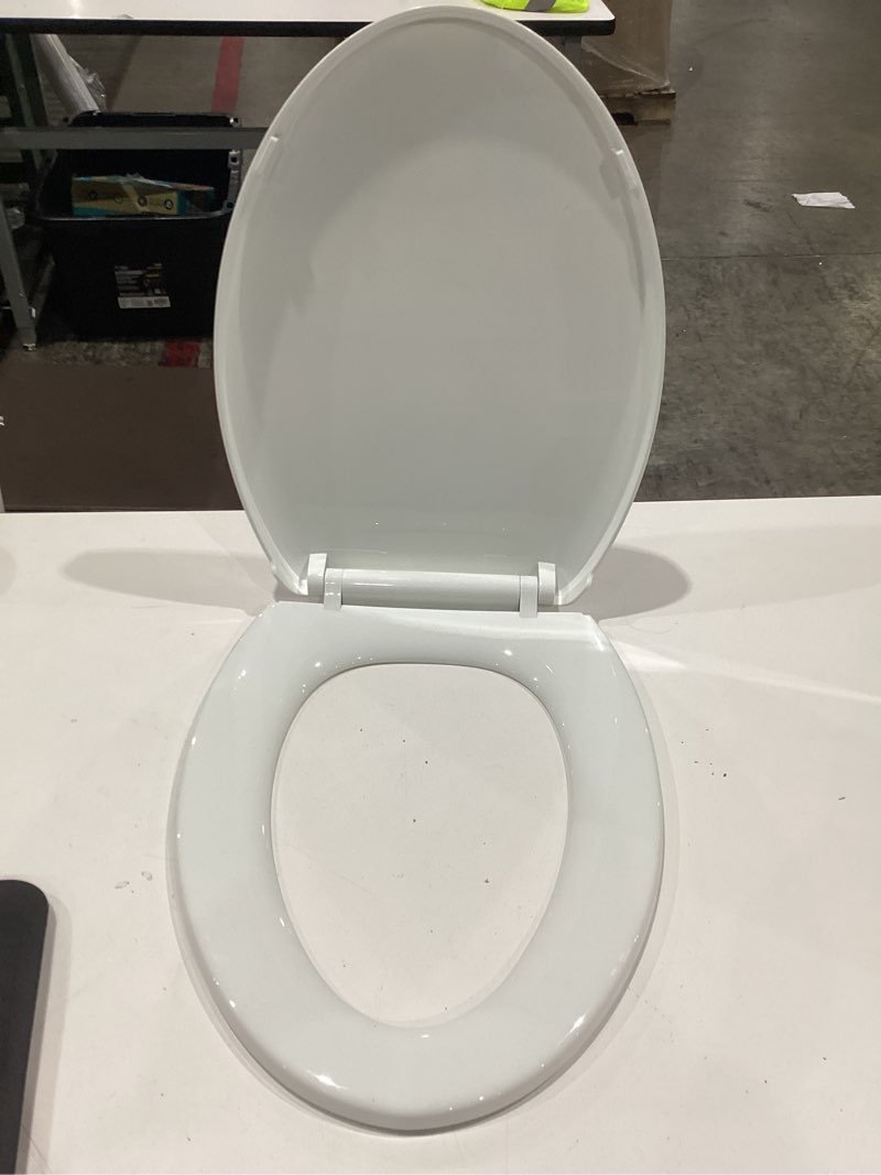Condition photo showing Good Condition for regular toilet seat w/soft close lid