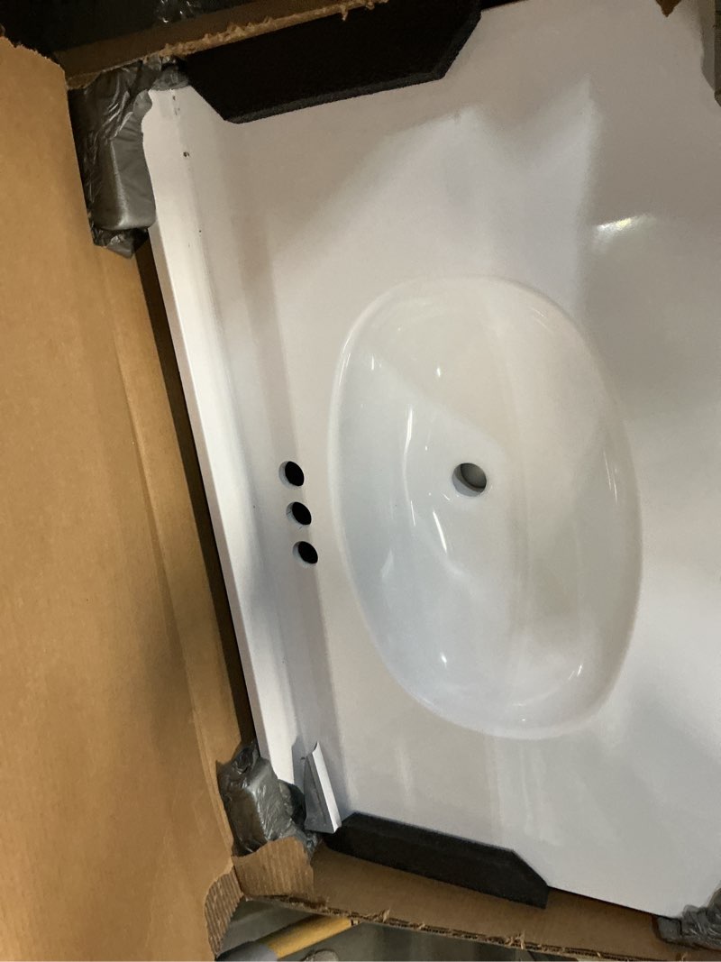 Condition photo showing As Is for  project source 37-in x 22-in white cultured marble single sink 4-in centerset faucet mount bathroom