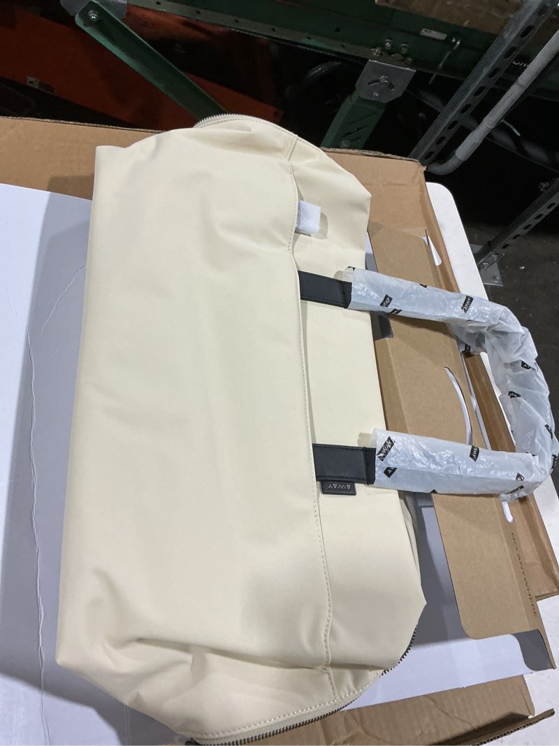 Condition photo showing Good Condition for away the overnight bag, airline approved carry-on travel duffle bag | 16-inch padded laptop pocket, removable shoulder strap, personal item travel bag with trolley sleeve, salt white