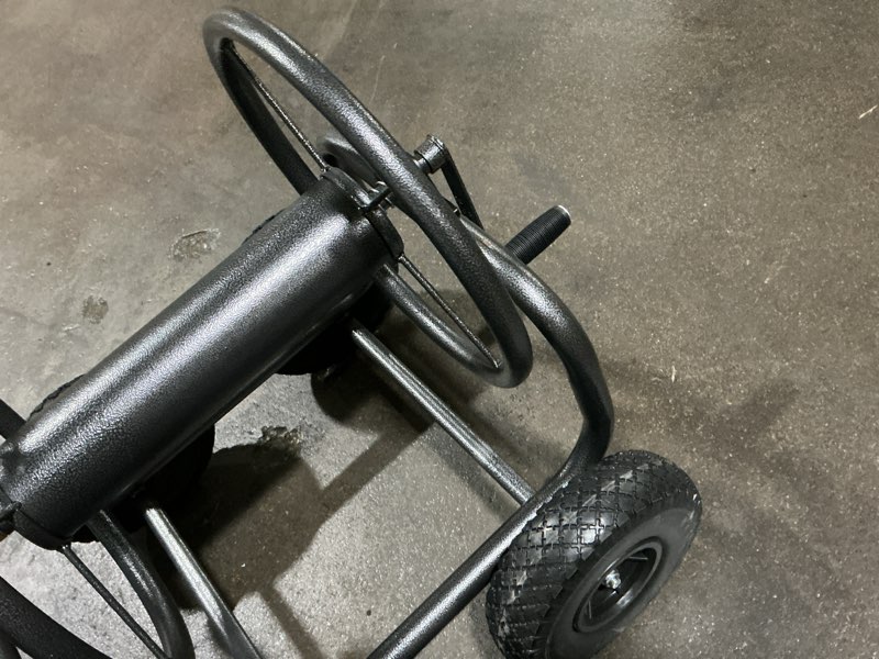 Condition photo showing As Is for steel 250-ft cart hose reel black