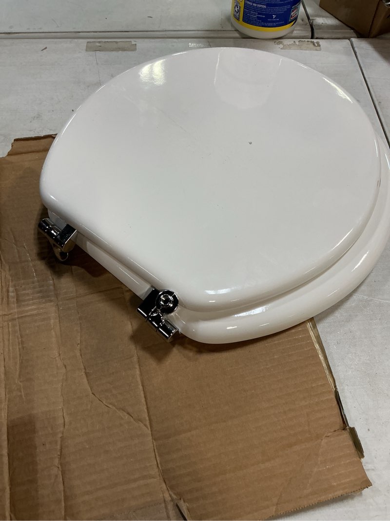 Condition photo showing As Is for Mayfair Padded Toilet Seat with Chrome Hinges, Soft Vinyl over Wood Core Seat, Made in USA, Round, White