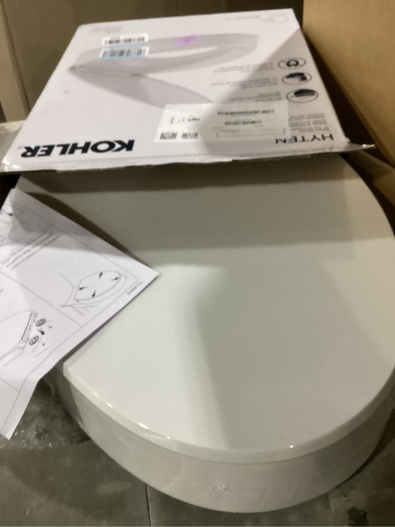 Condition photo showing New/Like New for kohler 25875-0 hyten 3" height, elevated soft close elongated toilet seat, contoured seat with grip-tight bumpers, quick-attach hardware, no slam toilet seat, white white elongated