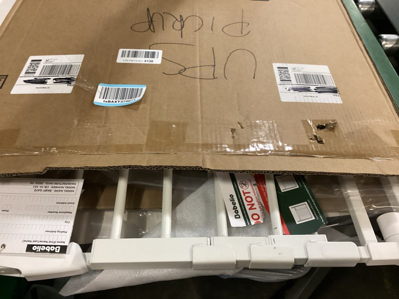 Condition photo showing As Is for Babelio 36" Tall Auto Close Baby Gate with Small Cat Door, 29-43" Metal Cat Gate for Doorway, Stairs, House. Easy Walk Thru Dog Gate with pet Door, Includes 4 Wall Cups and 3 Extension Pieces, White White 29-43" Wide, 36" Tall