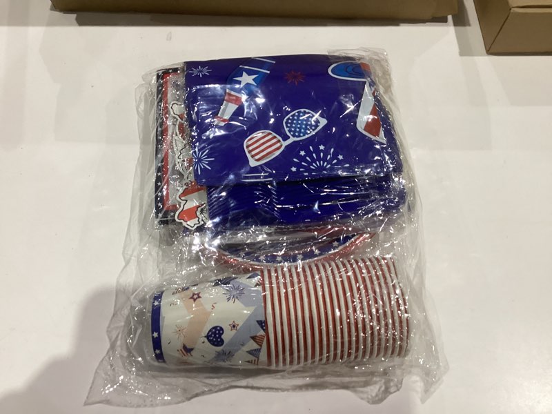 Condition photo showing New/Like New for Similar. 132PCS Patriotic Party Supplies, American Flag Themed Party Set with Plates Napkins Fork Tablecloth Red White Blue Paper Fans Star Streamer for Veterans Day Election Day 4th of July Independence Day