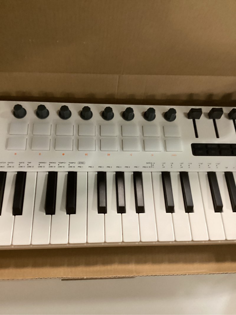 Condition photo showing Good Condition for SMK-37 PRO 37-Key MIDI Keyboard with DX-7 FM Synthesizer, Wireless MIDI & 8-Pattern Sequencer, 1.54'' Display, RGB Pads, Arpeggiator & With 16 Backlit Drum Pads, 8 Knobs and Music Production