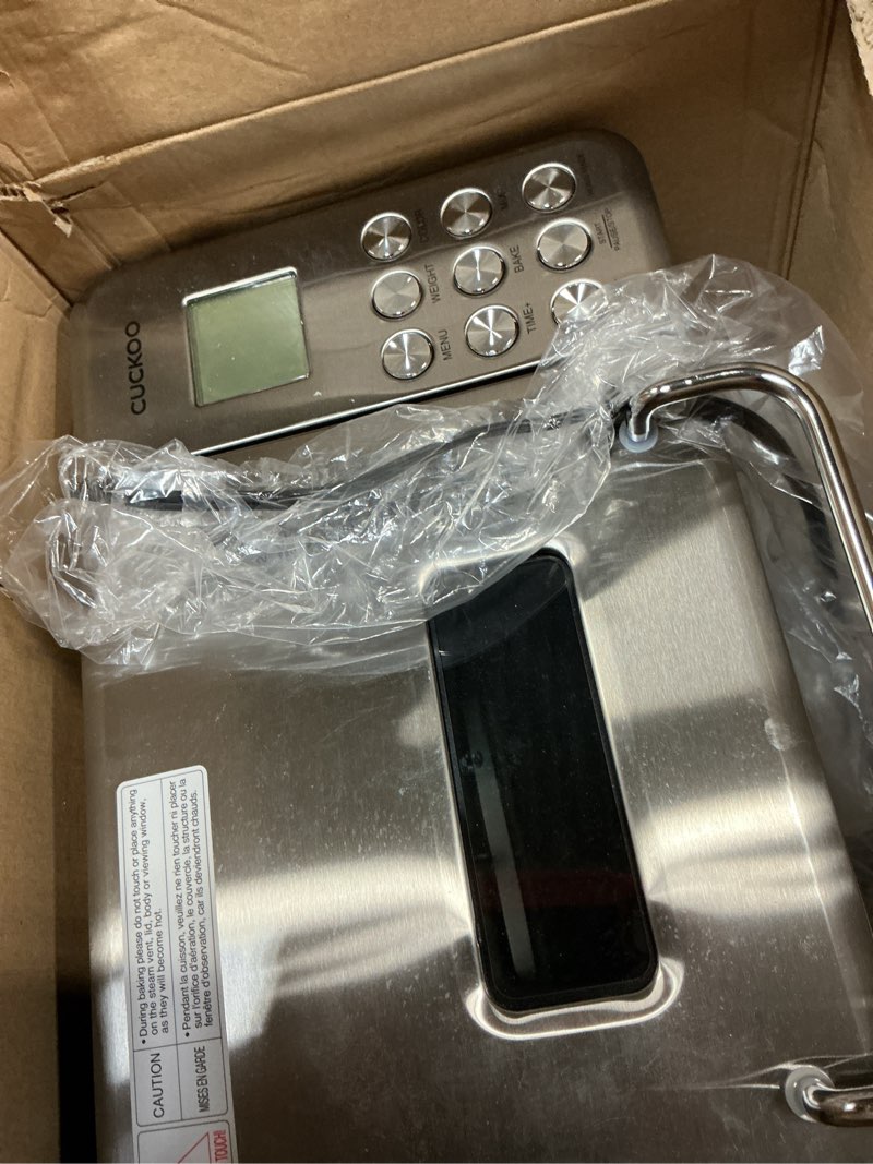 Condition photo showing As Is for CUCKOO Bread Maker Machine with 15 Menu Options + 3 Crust Colors, 2 lbs Bread Machine with Automatic Fruit & Nut Dispenser, Includes 6 Accessories, Ideal Breadmaker for Sourdough (CBM-AAB101S)