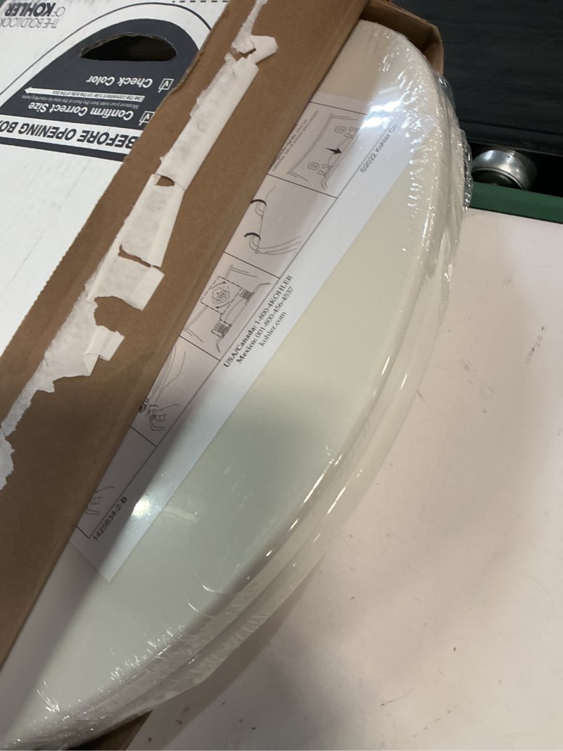 Condition photo showing New/Like New for kohler 20110-96 brevia, slow close toilet seat, elongated toilet seat, grip-tight bumpers quick-attach hardware, biscuit biscuit elongated quiet-close