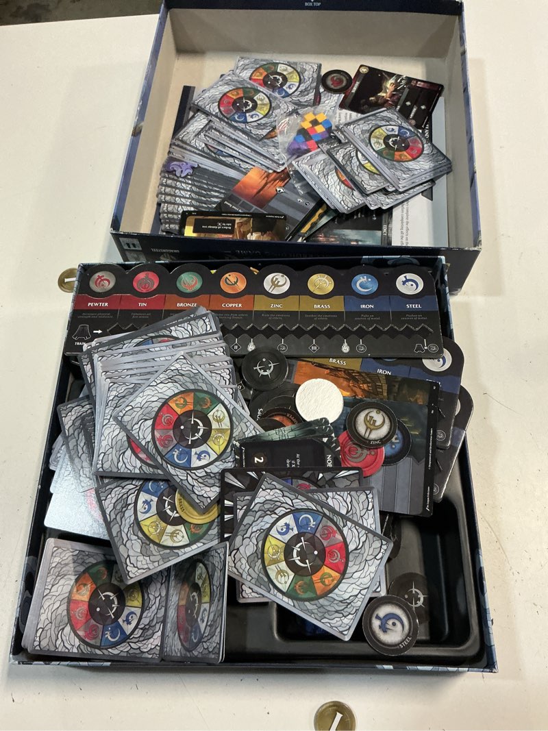Condition photo showing As Is for mistborn deckbuilding game by brotherwise games | fantasy card strategy with allomantic powers | build your deck, burn metals, and battle through cinematic missions | 1 to 4 players | ages 13+