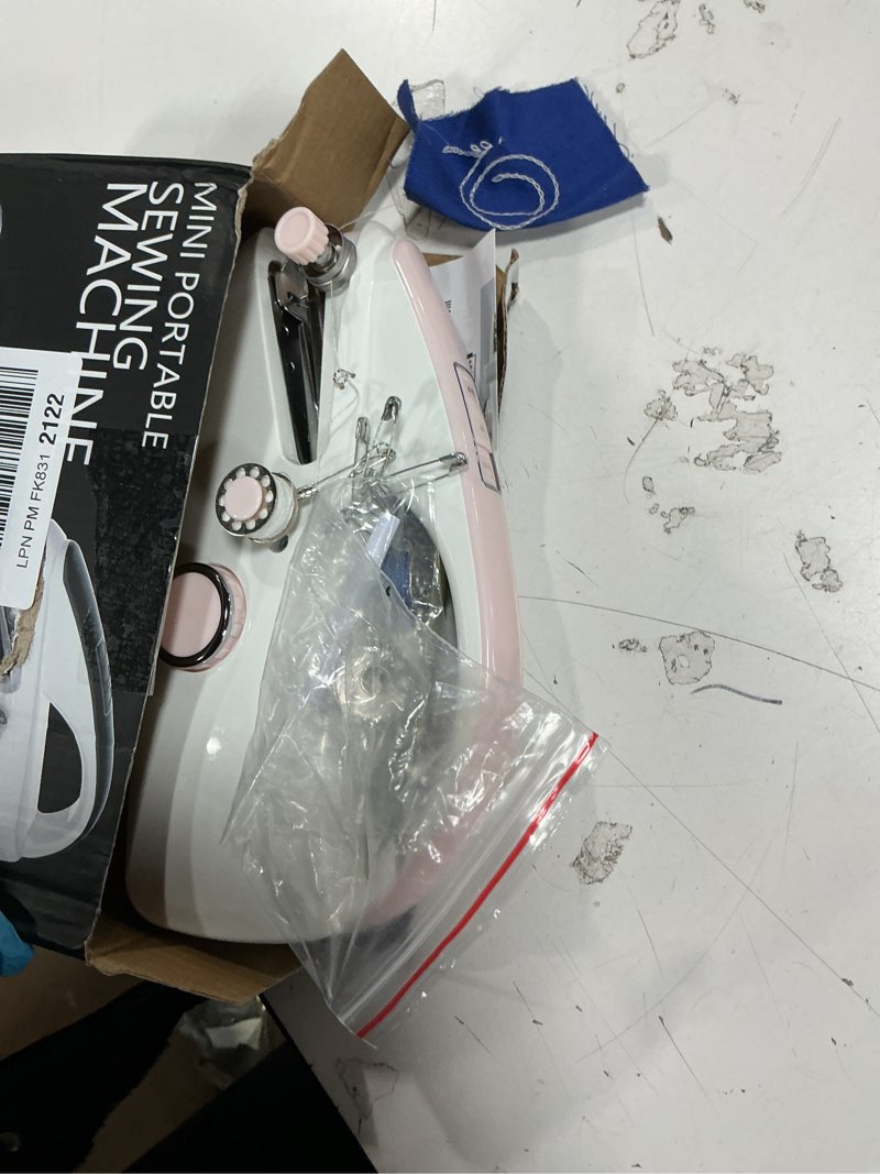 Condition photo showing As Is for Handheld Sewing Machine,Portable,Mini Sewing Machine,Easy to Use,Fast Sewing Speed,Suitable for Sewing Clothes,Fabric,DIY Home Machine for Beginners.(pink)