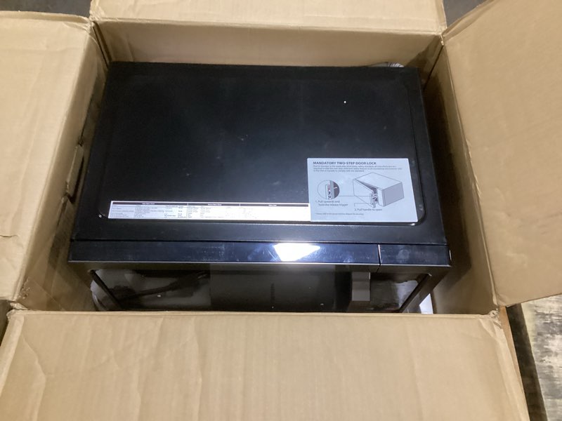 Condition photo showing As Is for TOSHIBA EM131A5C-BS Countertop Microwave Ovens 1.2 Cu Ft, 12.4" Removable Turntable Smart Humidity Sensor 12 Auto Menus Mute Function ECO Mode Easy Clean Interior Black Color 1000W 1.2 Cu.Ft. Black