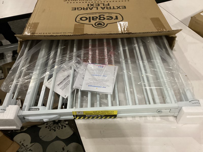 Condition photo showing Good Condition for regalo safety 28"-76” super wide configurable baby gate for doorways & open spaces, 3-panel wall mounted safety gate with door for babies, toddlers & pets, includes wall mount hardware 28-76"w x 30"h white