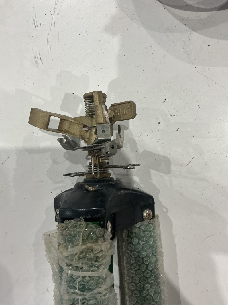 Condition photo showing As Is for (used)orbit sprinkler 5000-sq ft impulse tripod lawn sprinkler