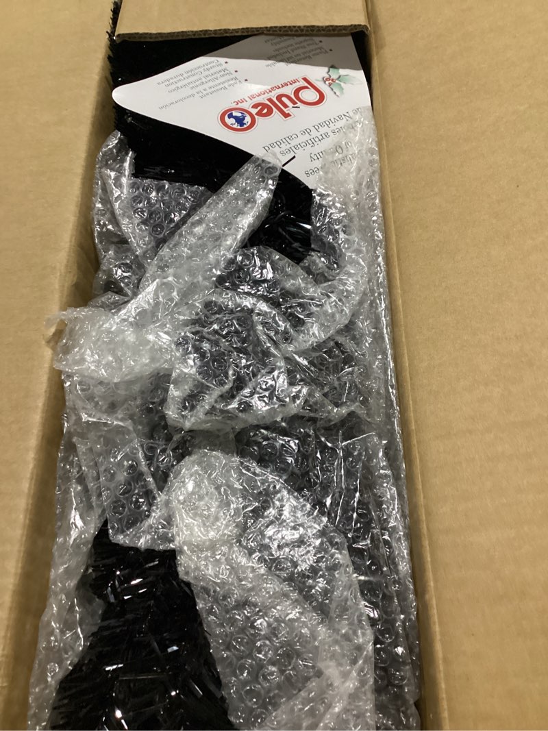 Condition photo showing New/Like New for Puleo International 4 ft Pre-Lit Black Artificial Alpine Pencil Tree 136 Tips 50 Clear Lights