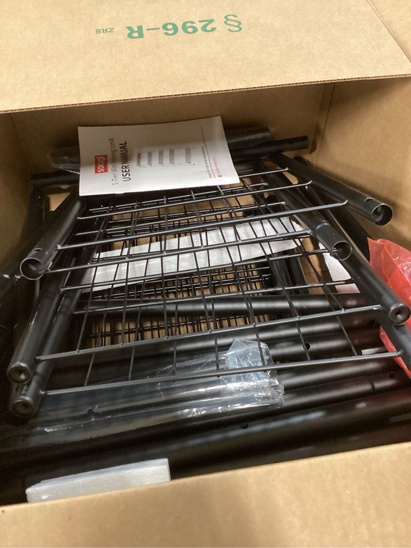 Condition photo showing As Is for sakugi storage shelves - 5 tier shelf organizer, heavy duty garage shelving unit with leveling feet, stable metal shelves organizer for pantry, kitchen and closet, 33.0" w x 12.6" d x 72.0" h, black