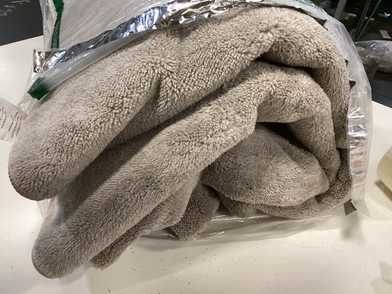 Condition photo showing As Is for tan area rug, size unknown 