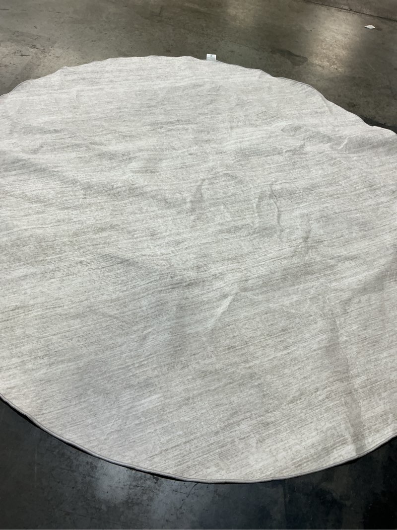 Condition photo showing As Is for nourison essentials indoor/outdoor ivory beige 8' x round area rug, easy cleaning, non shedding, bed room, living room, dining room, backyard, deck, patio (8 round)
