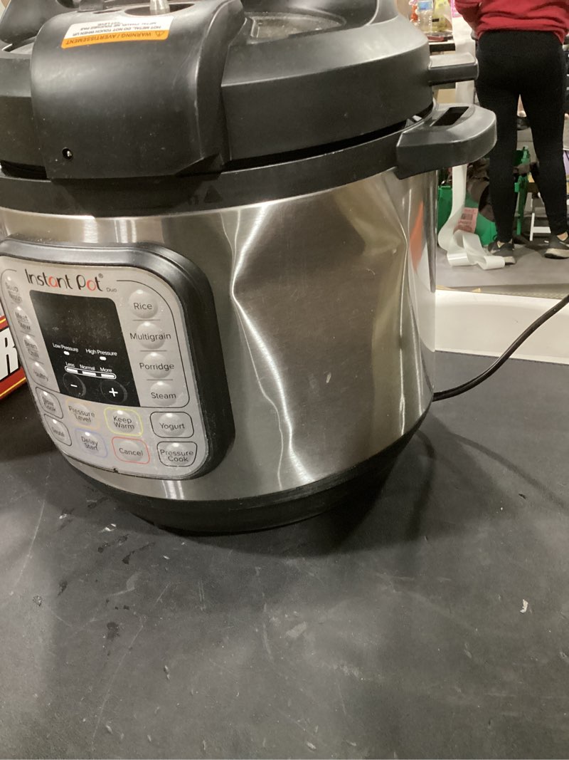 Condition photo showing As Is for instant pot duo 7-in-1 electric pressure cooker, slow cooker, rice cooker, steamer, sauté, yogurt maker, warmer & sterilizer, includes app with over 800 recipes, stainless steel, 8 quart 8 quarts