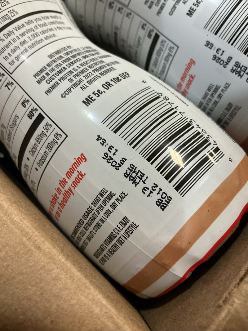 Condition photo showing Good Condition for (Best by  mar 13 2026)Premier Protein Shake, Café Latte, 30g Protein, 1g Sugar, 24 Vitamins & Minerals, Nutrients to Support Immune Health, 11.5 fl oz (pack 12)