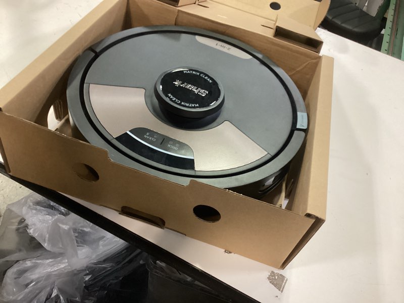 Condition photo showing New/Like New for Shark Matrix Plus 2in1 Robot Vacuum & Mop with Sonic Mopping, Matrix Clean, Home Mapping, HEPA Bagless Self Empty Base, CleanEdge, for Pet Hair, WiFi, Black/Brass, AV2620WA Wet&Dry Self-Empty (45 Day)(Black/Brass)