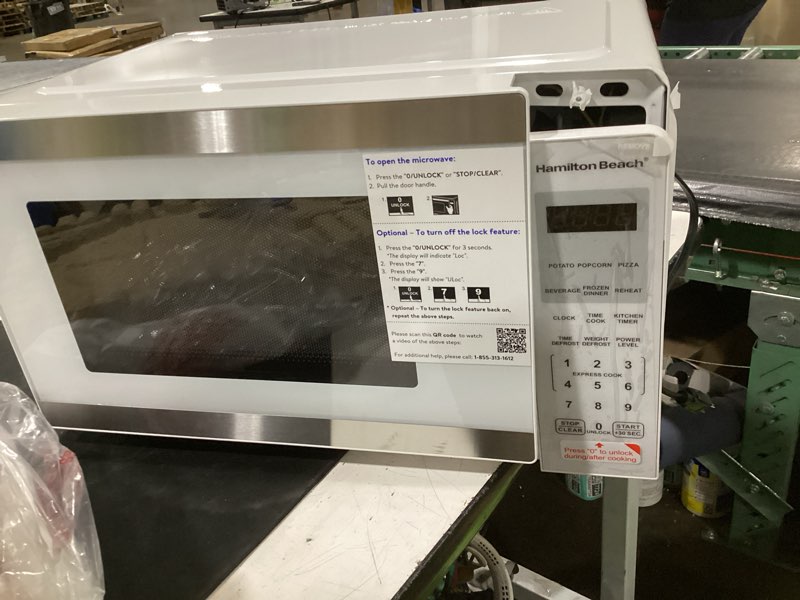 Condition photo showing As Is for (parts only) hamilton beach microwave oven 0.9 cu ft 900w white stainless steel