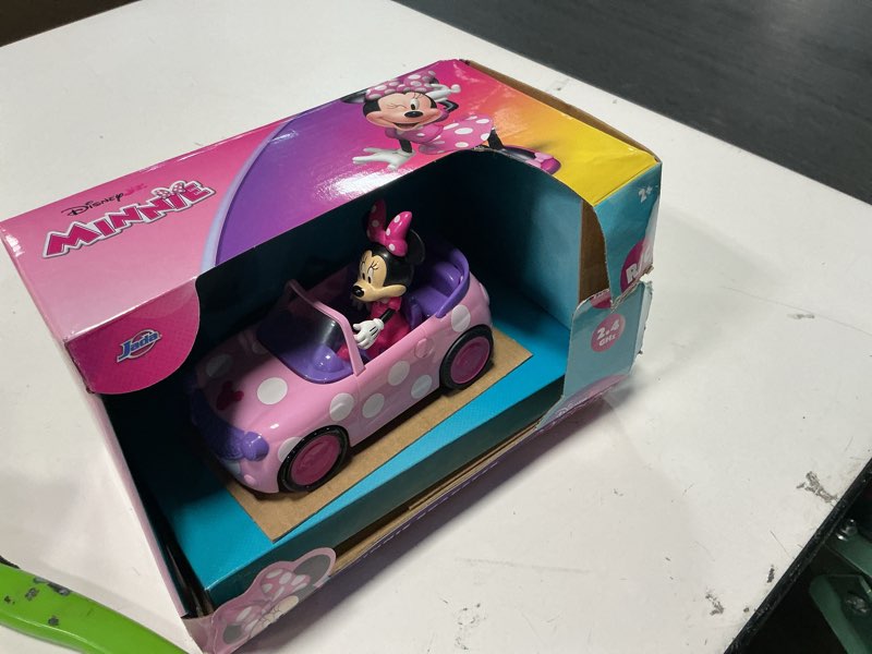Condition photo showing As Is for disney minnie remote control vehicle 1:32 scale