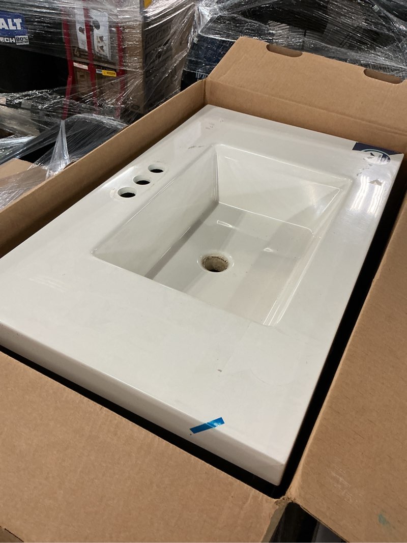 Condition photo showing As Is for project source davies 30-in sandstone single sink bathroom vanity with white cultured marble top