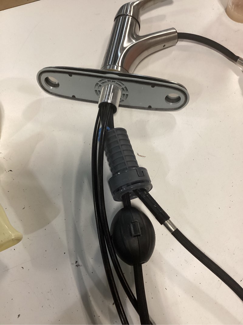 Condition photo showing As Is for project source everfield stainless steel single handle deck-mount pull-out kitchen faucet with sprayer (includes deck plate)