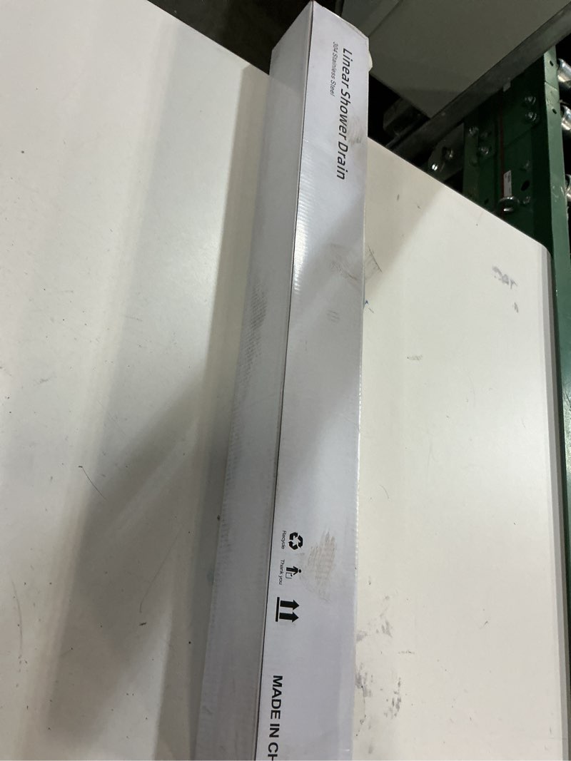 Condition photo showing New/Like New for Linear Shower Drain ?28 Inch Brushed 304 Stainless Steel Rectangle Shower Floor Drain?with Reversable Tile-inPattern Drain Cover & Hair Catcher, Adjustable Feet 28inch Brushed Nickel