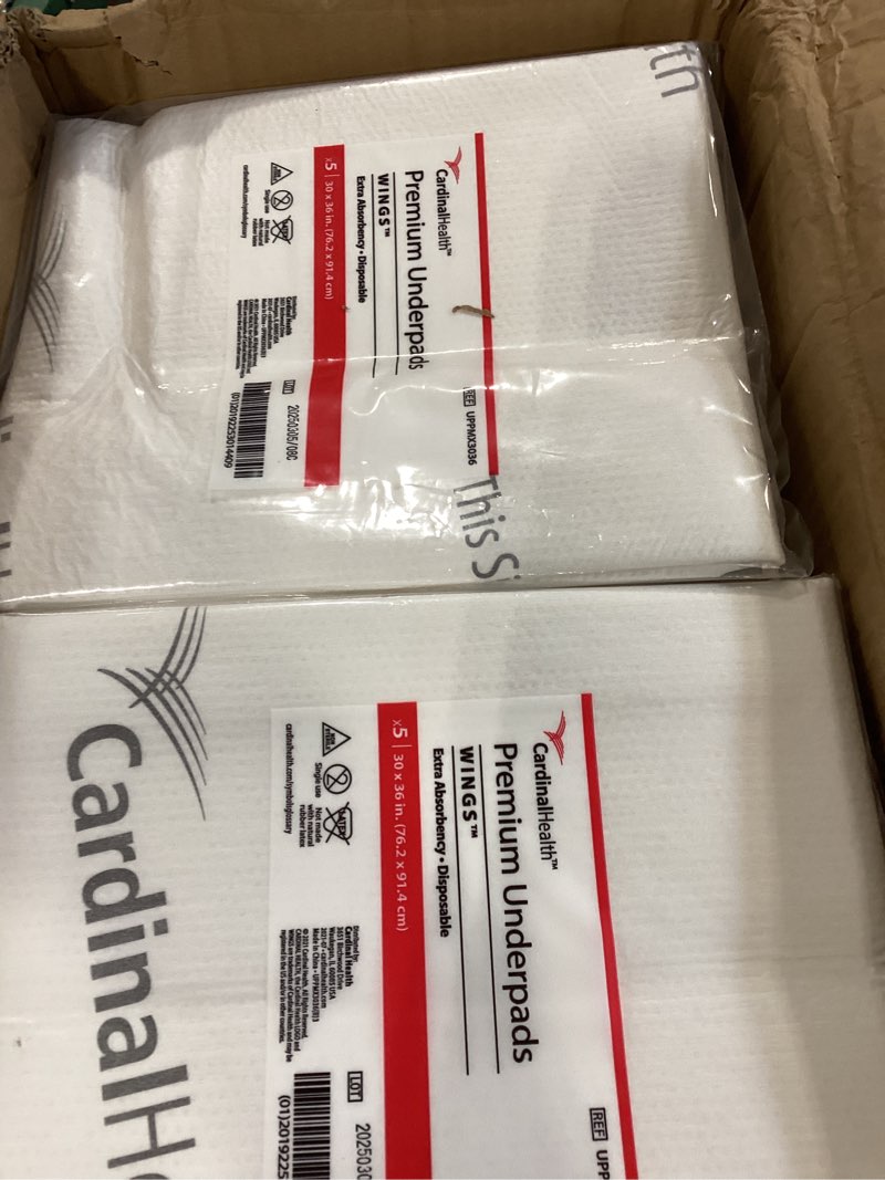 Condition photo showing As Is for cardinal health uppmx3036 premium underpad, wings maximum absorbency, white, 30 x 36in (1 case of 70 eaches) 30 in x 36 in case of 70
