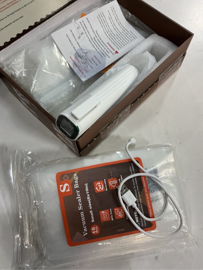 Condition photo showing New/Like New for compact vacuum sealer for food (contains 30 reusable seal bags) featuring led pressure display, ultimate suction power, handheld vacuum sealer machine, portable food sealer vacuum sealer (with 30 bags)