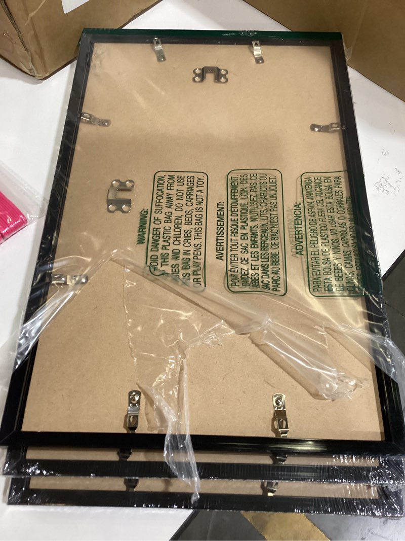 Condition photo showing As Is for fxojyvo 10x16 picture frame set of 3, black frame for 10 x 16 inch picture poster photo, light weight and high transparent 10 by 16 frame for wall - 3 pack/black/10 x16 black 10x16 3 packs